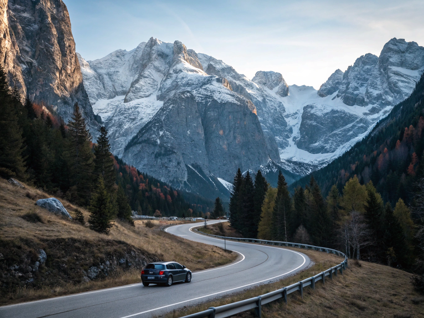 Scenic Alpine winter pass road with snowy mountain peaks